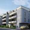 Moderne Mehrfamilienhäuser mit Balkonen, Garageneinfahrt und Fahrradfahrer vor zeitgenössischer Wohnanlage in Frankfurt